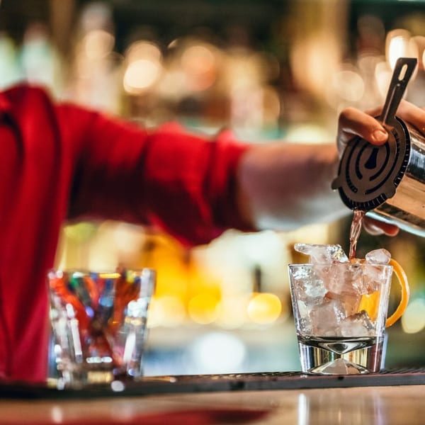 Bartender pouring a cocktail