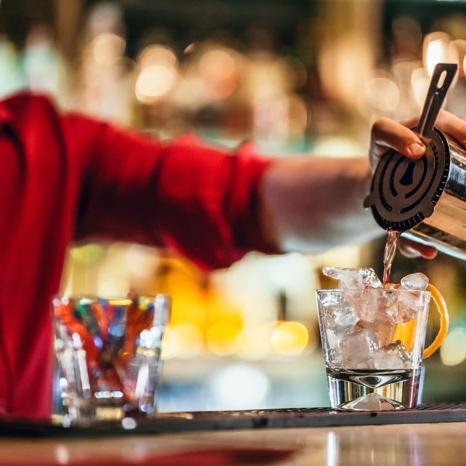Bartender pouring a cocktail